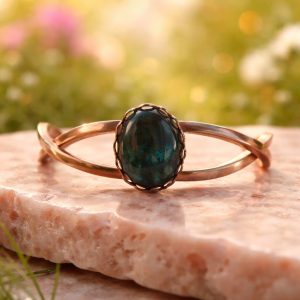 Gold-Tone Hinged Bangle Bracelet with Oval Forest Green Cabochon